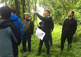 people in a field looking at something